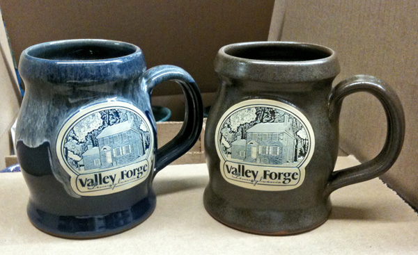 Two Patriot mug, one blue and one brown 